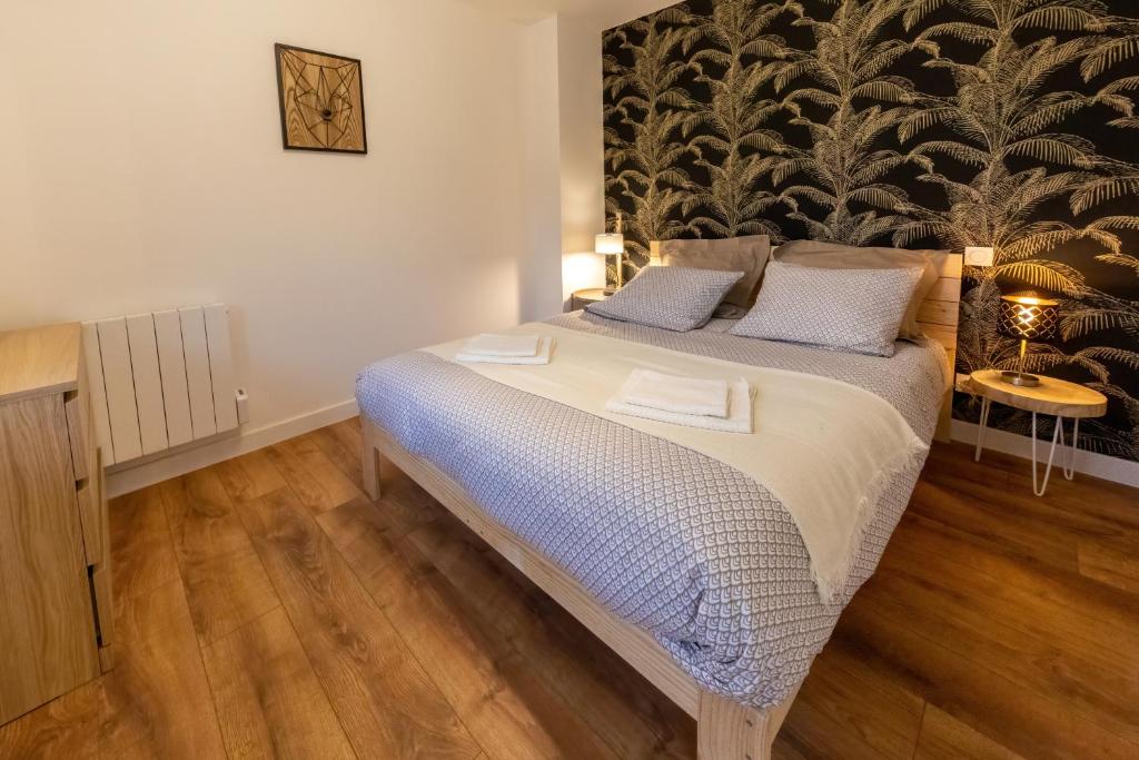 Posteľ alebo postele v izbe v ubytovaní Les appartements de Clélia