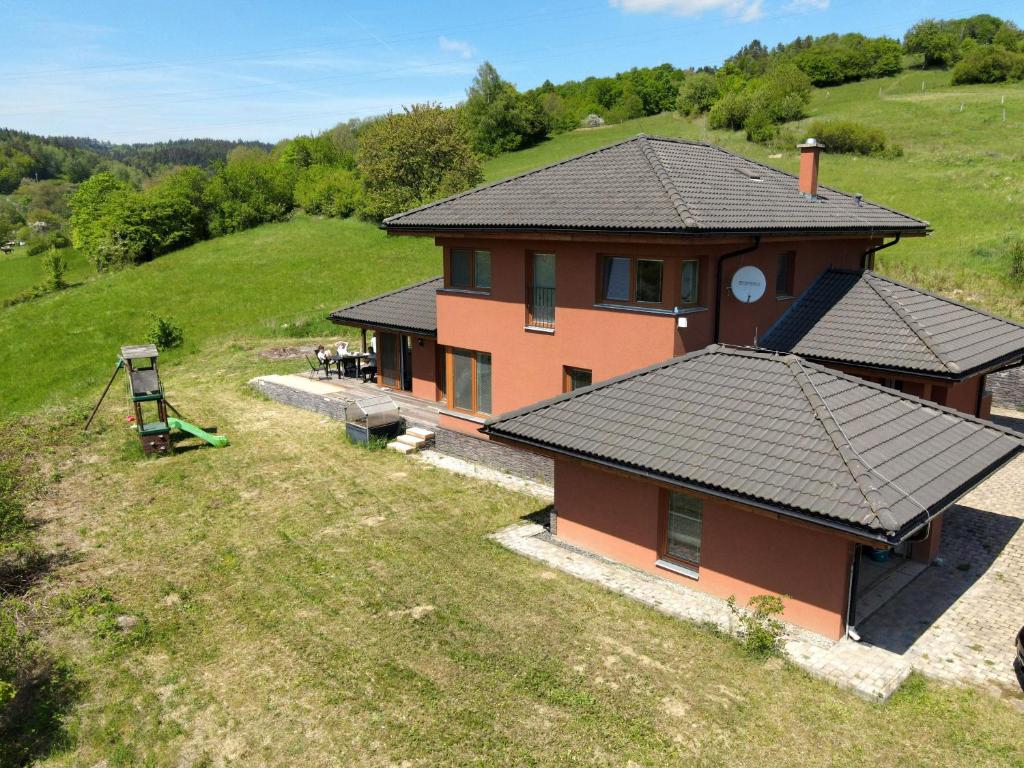 an aerial view of a house in a field at Vila nad Liptálem - Celý objekt, poblíž domu je rekreační oblast Všemina in Vsetín