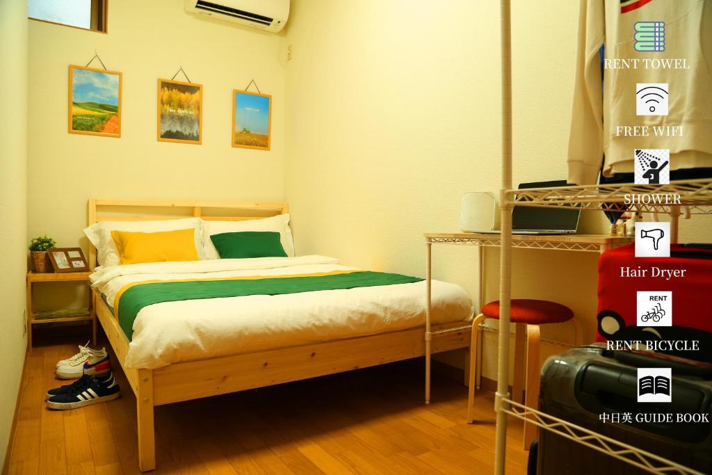 a small bedroom with a bed and a suitcase at TOKYO E JOY INN West Shinjuku Branch in Tokyo
