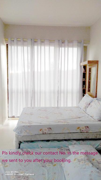 Postel nebo postele na pokoji v ubytování Splendido Tagagtay Taal Lake Staycation Free Parking Netflix No Free Pool