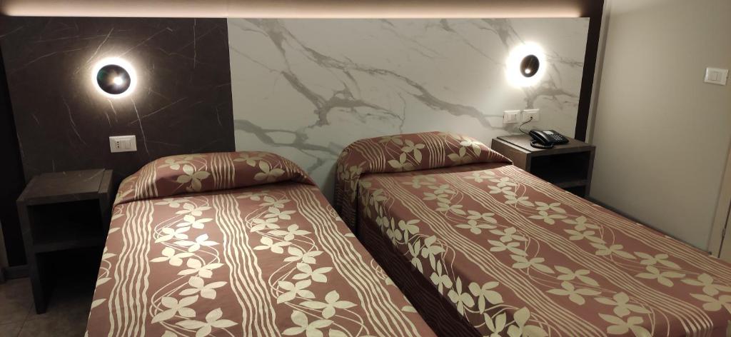 Postel nebo postele na pokoji v ubytování Hotel Mistral
