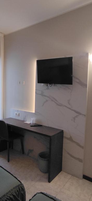 TV a/nebo společenská místnost v ubytování Hotel Mistral