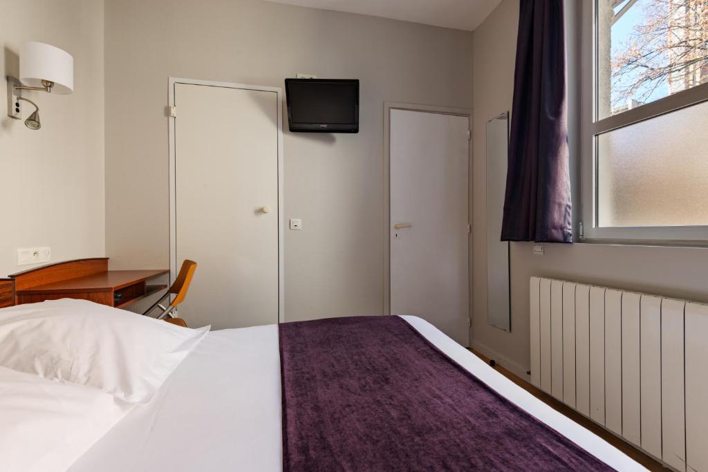 Postel nebo postele na pokoji v ubytování Hôtel Icare