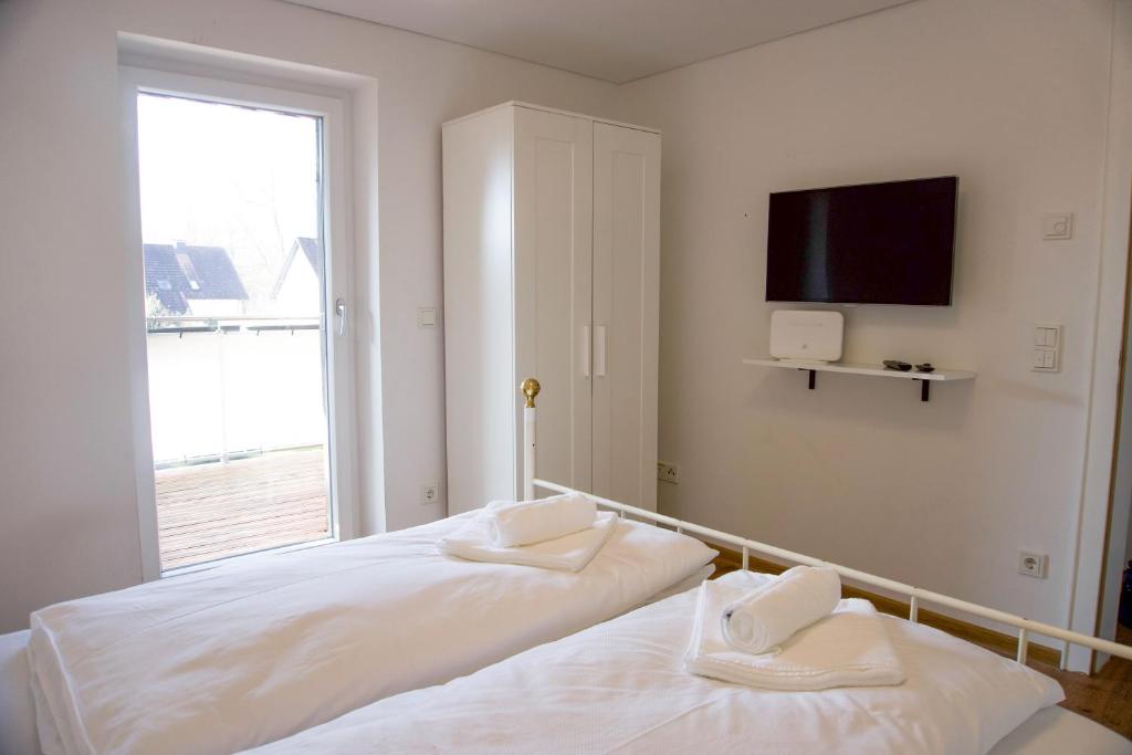 Postel nebo postele na pokoji v ubytování homy Central City Oasis in Dornbirn