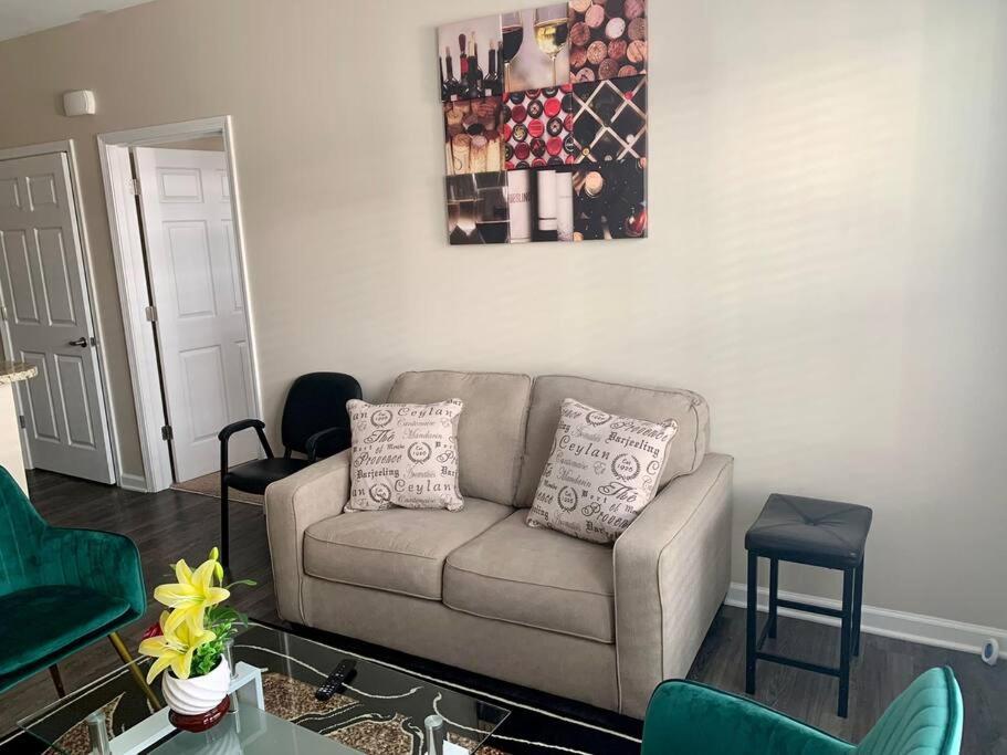 a living room with a couch and a table at A Cozy /Luxury One bedroom in Downtown Indy in Indianapolis