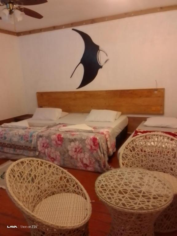 Postel nebo postele na pokoji v ubytování Ocean Way Guraidhoo