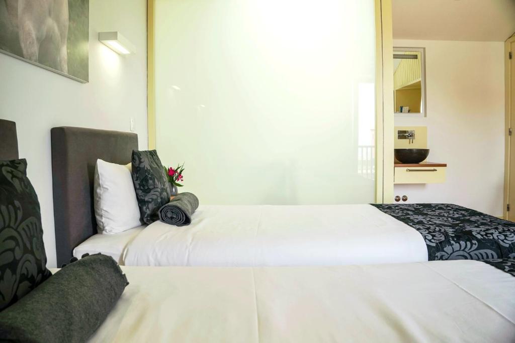 Postel nebo postele na pokoji v ubytování Pátio Ecolodge