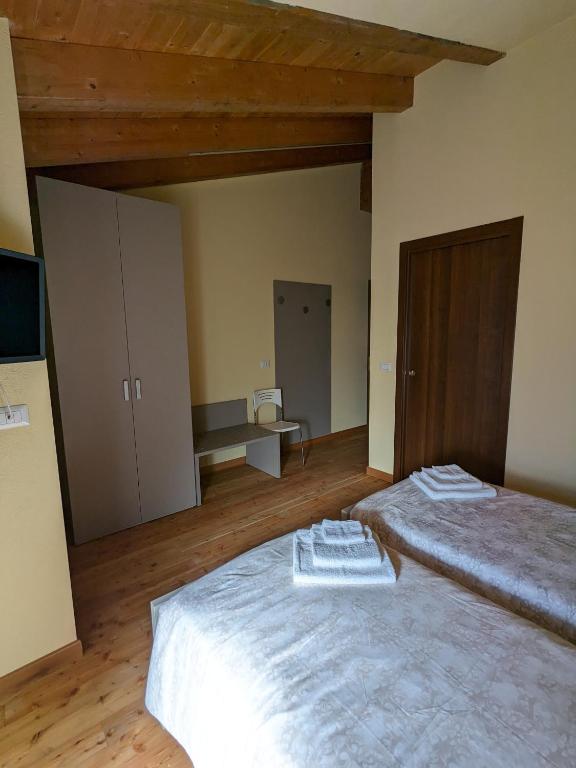Postel nebo postele na pokoji v ubytování CONSTANCIA TRATTORIA