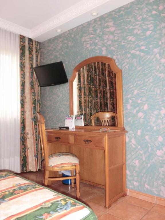Postel nebo postele na pokoji v ubytování Hotel Las Ruedas
