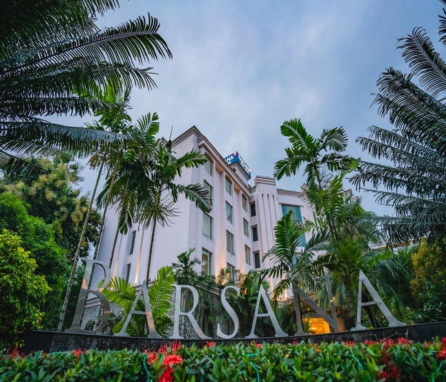 a hotel with a sign in front of it at Barsana Hotel & Resort Siliguri in Siliguri