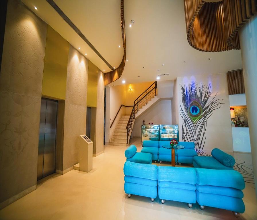 Postel nebo postele na pokoji v ubytování Barsana Hotel & Resort Siliguri