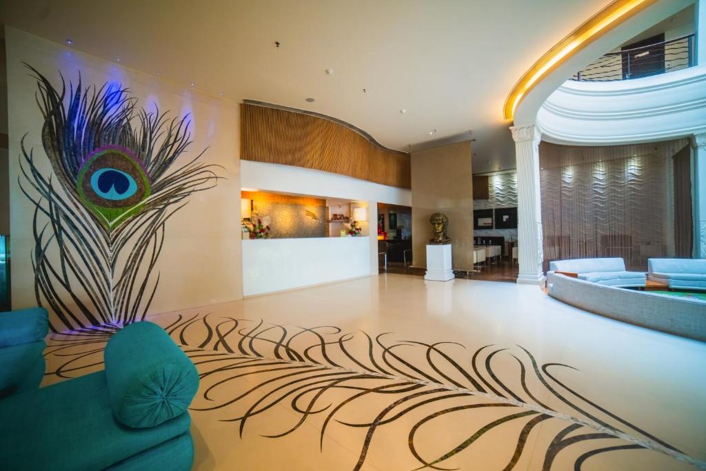 Postel nebo postele na pokoji v ubytování Barsana Hotel & Resort Siliguri