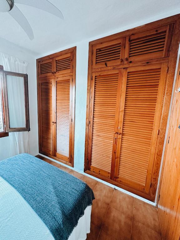 Postel nebo postele na pokoji v ubytování Sa caseta de Fornells