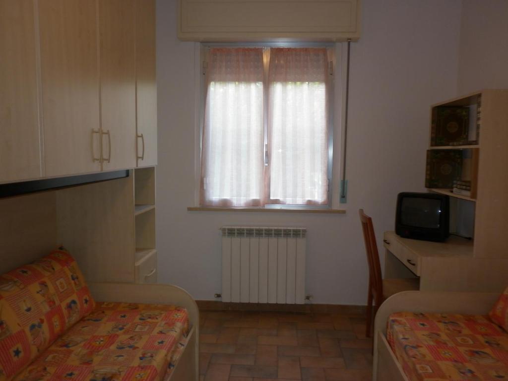 A television and/or entertainment centre at Villa Jolanda