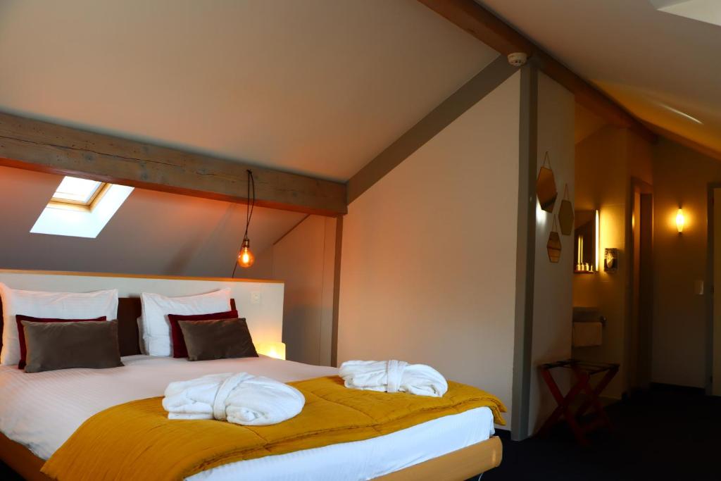 Voodi või voodid majutusasutuse La Clef D'Or Auberge Communale toas
