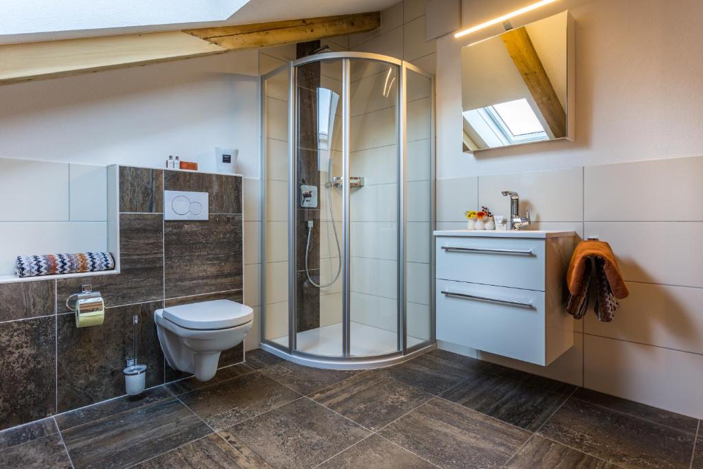 a bathroom with a shower and a toilet at Alpen Appartement BelEtage in Mayrhofen