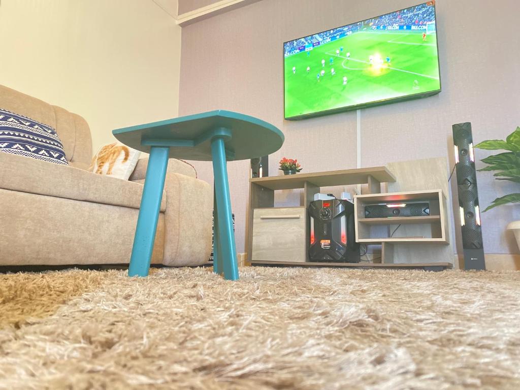 TV a/nebo společenská místnost v ubytování The Cream Loft