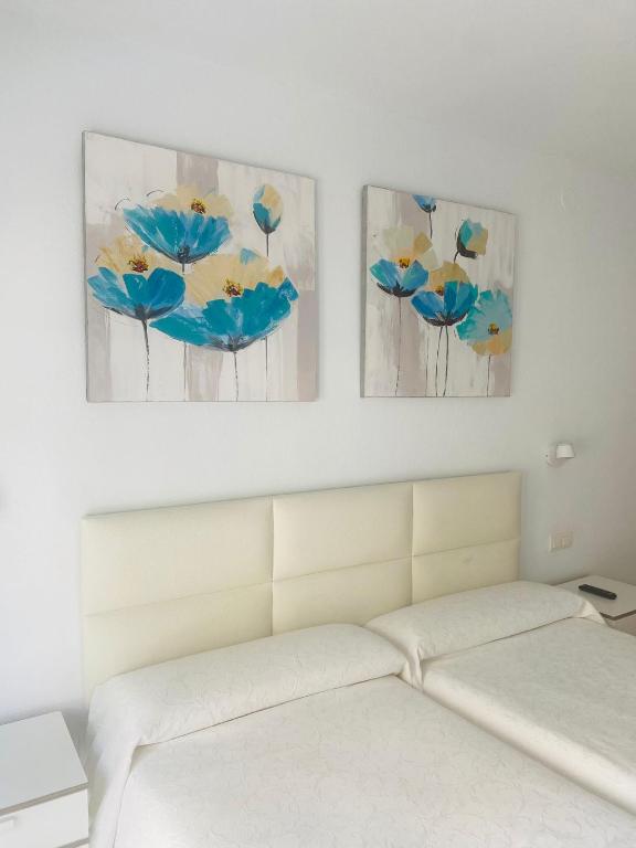 Postel nebo postele na pokoji v ubytování Hostal Tres Soles