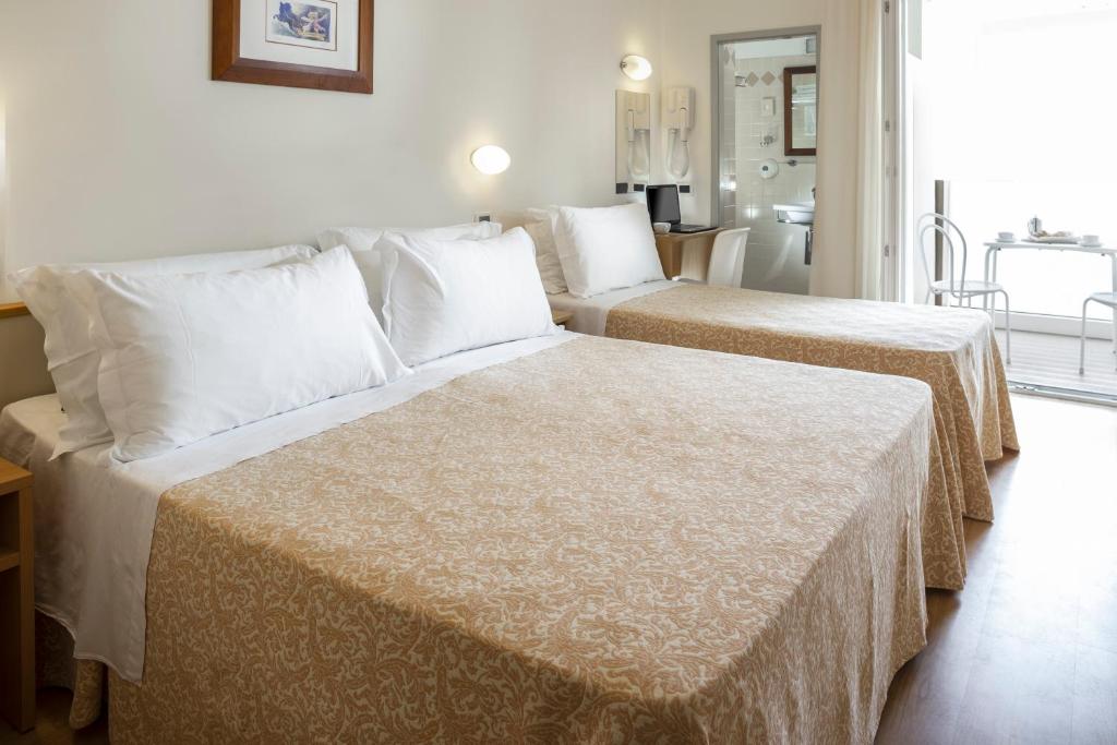 Postel nebo postele na pokoji v ubytování Hotel Baltic
