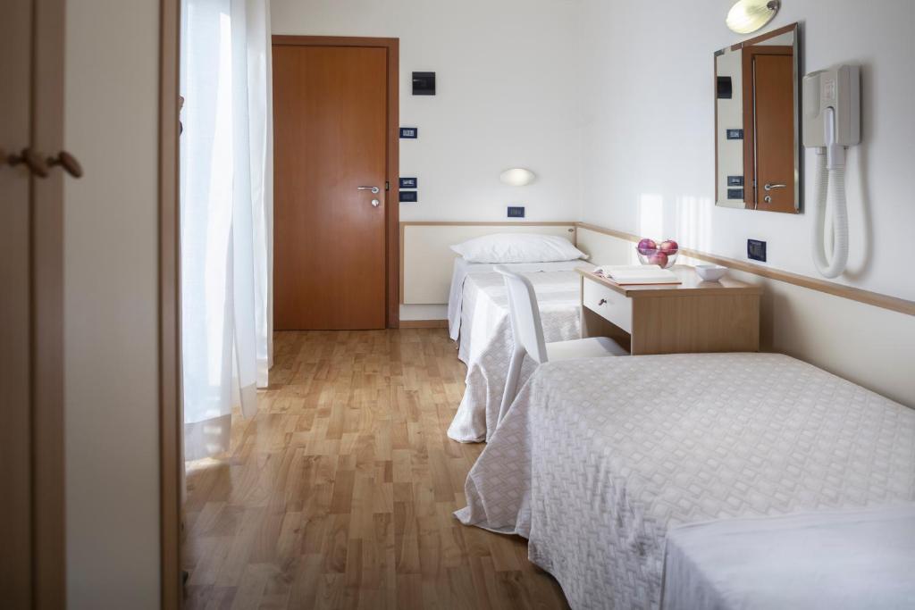 Postel nebo postele na pokoji v ubytování Hotel Baltic