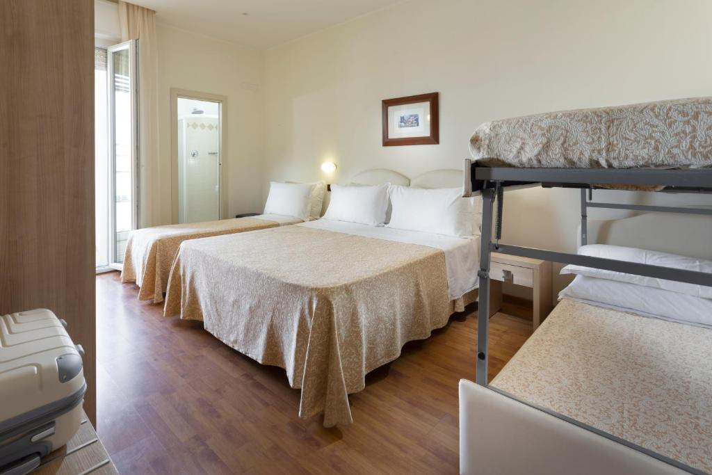 Postel nebo postele na pokoji v ubytování Hotel Baltic