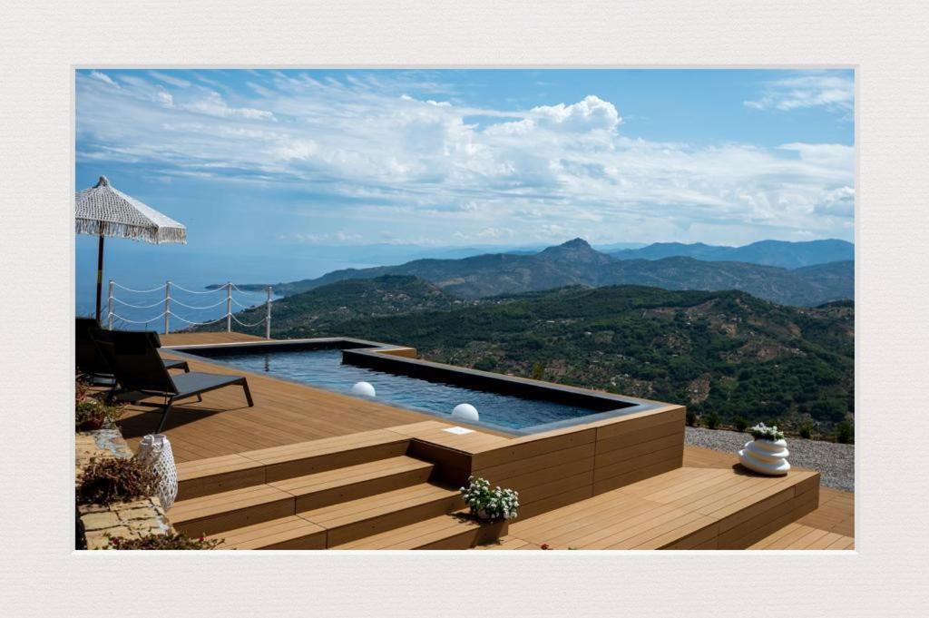 a swimming pool with a view of the mountains at Villa Magliolo in Cefalù