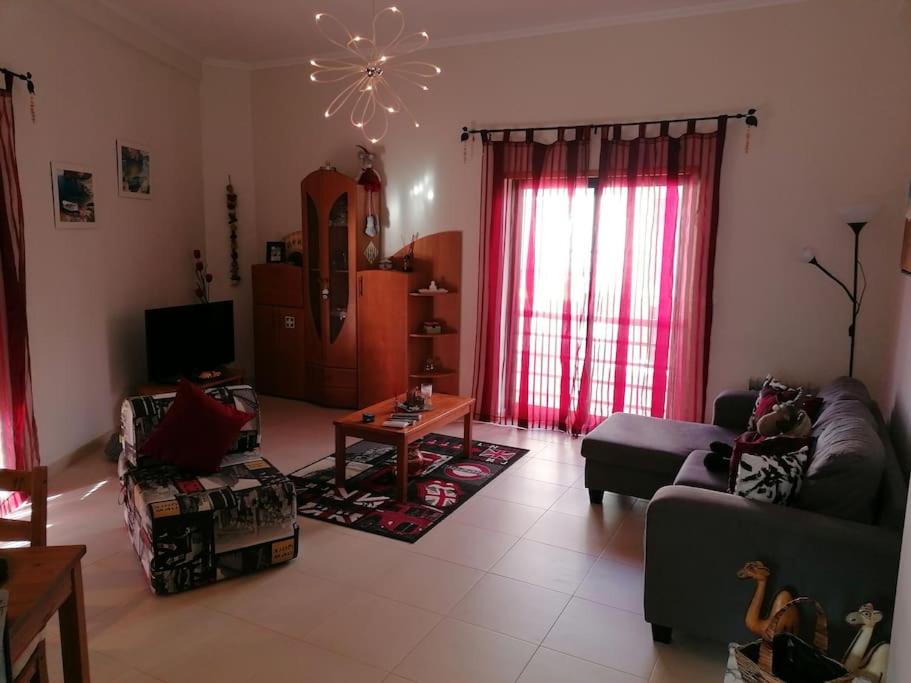 a living room with a couch and a table at AL - Amar Odeceixe in Odeceixe