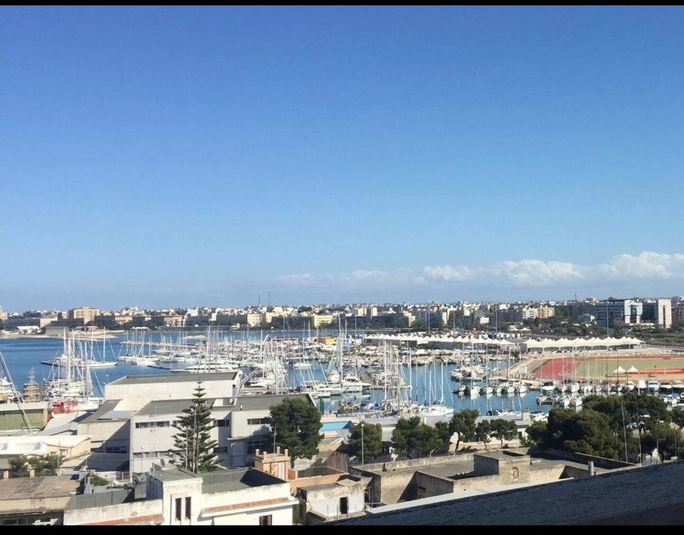 a view of a harbor with boats in the water at Faro exclusive suite in Bari