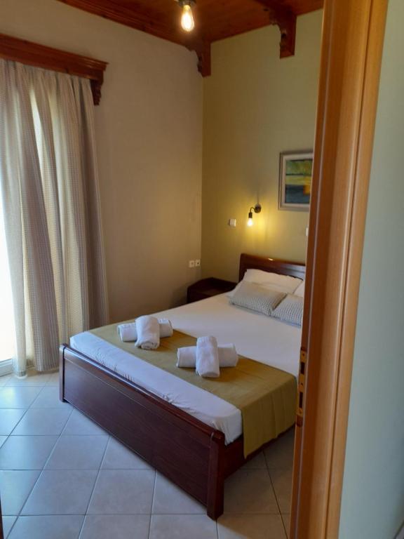 Postel nebo postele na pokoji v ubytování Katerina house