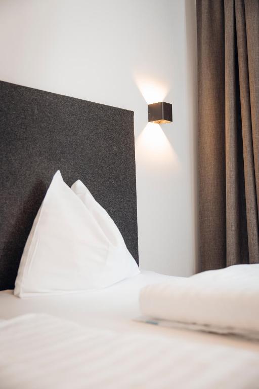 Postel nebo postele na pokoji v ubytování Hotel Gasthof Hirschentenne