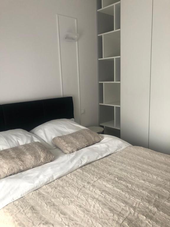 Posteľ alebo postele v izbe v ubytovaní Apartment by Gustav