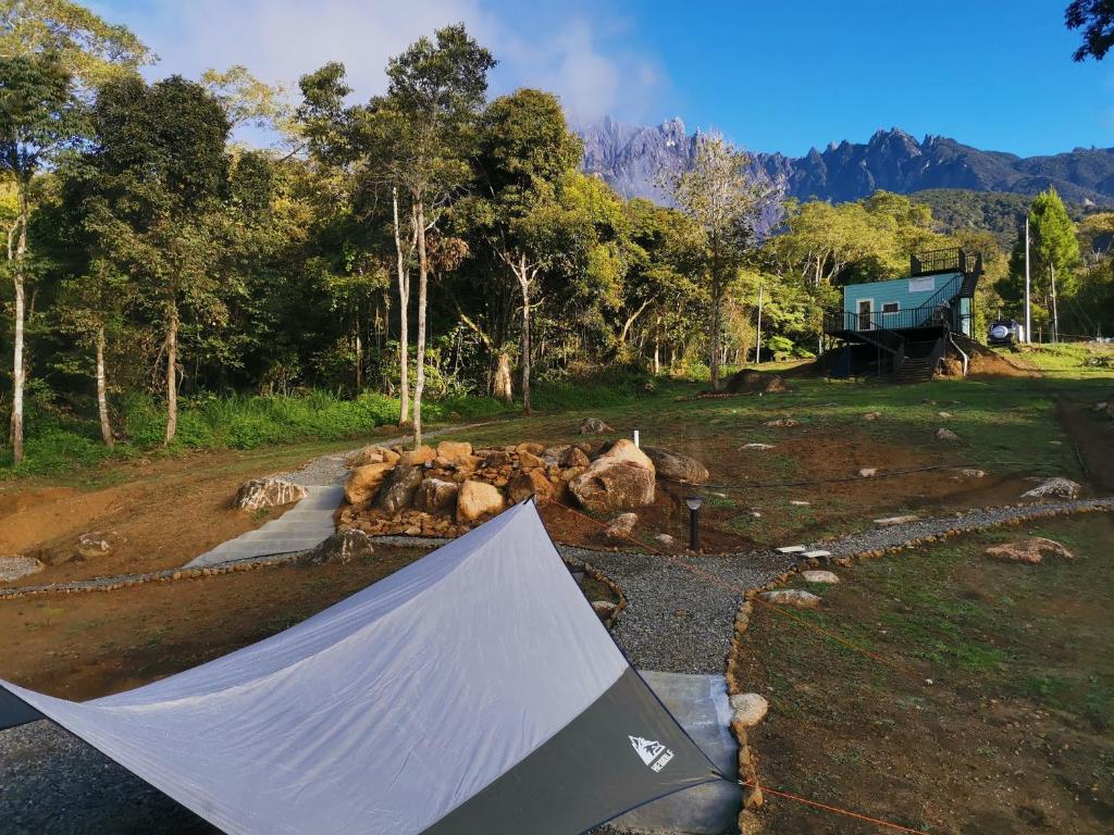 a skateboard ramp in a field with some animals at The Mountain Camp at Mesilau, Kundasang by PrimaStay in Ranau