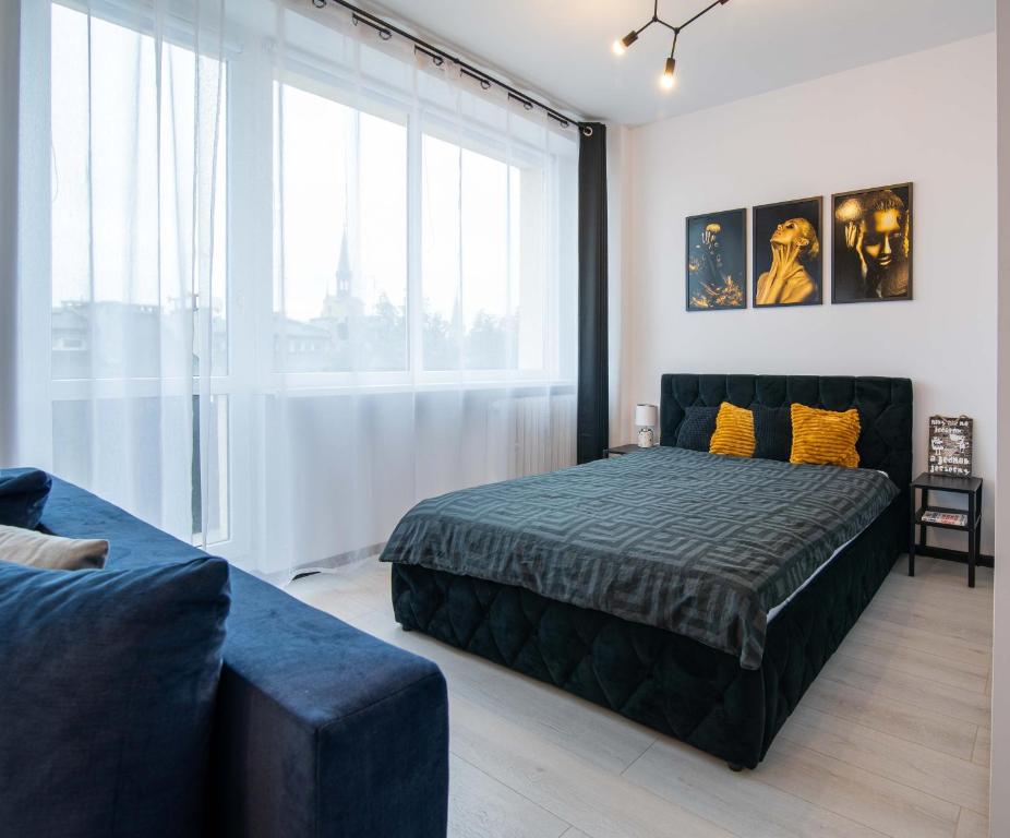 Posteľ alebo postele v izbe v ubytovaní Glamour Apartment - w samym sercu miasta obok rynku, klimatyzacja, możliwy parking gratis