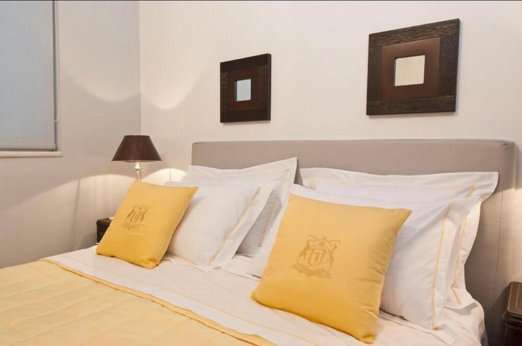 A bed or beds in a room at Luxury Acropolis View Duplex Penthouse in Thiseio 155m2