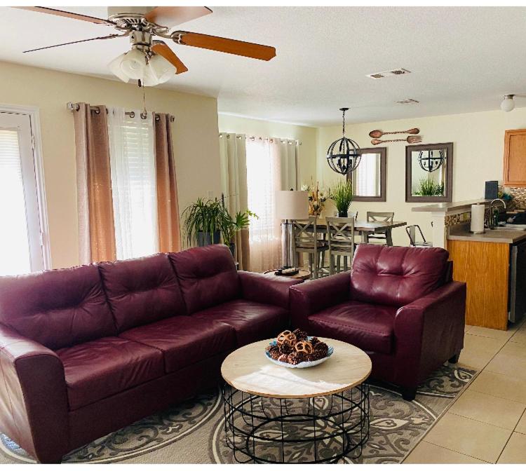 a living room with a couch and a table at Cozy5star in Killeen