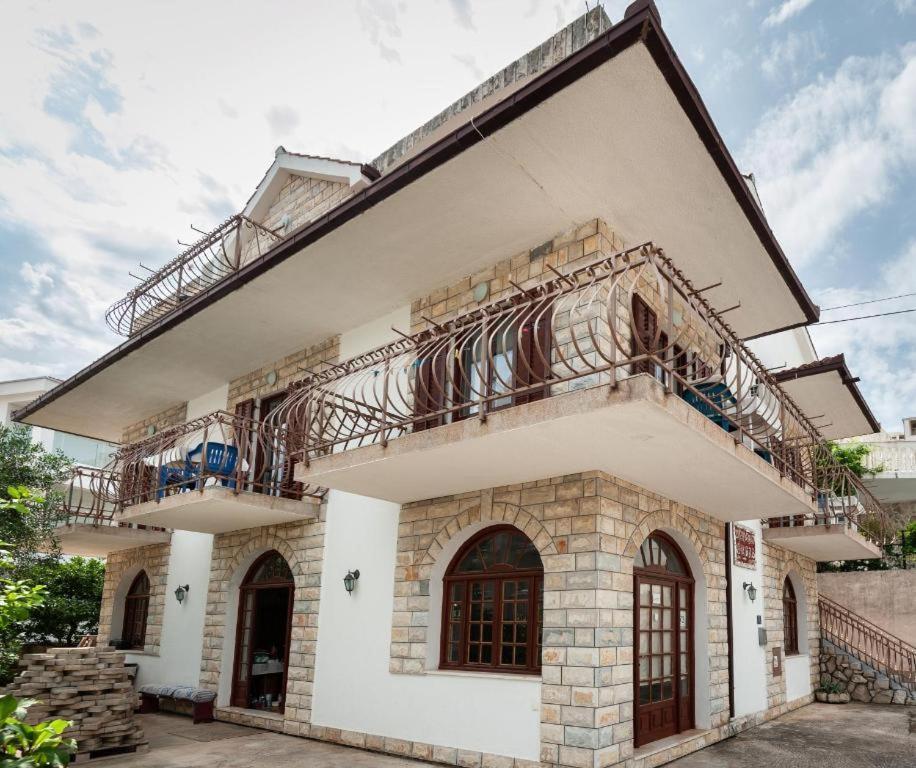 a building with two balconies on top of it at Maribela Apartments in Trogir