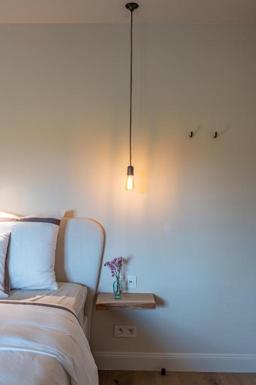 Postel nebo postele na pokoji v ubytování B&B 't Kloosterveld