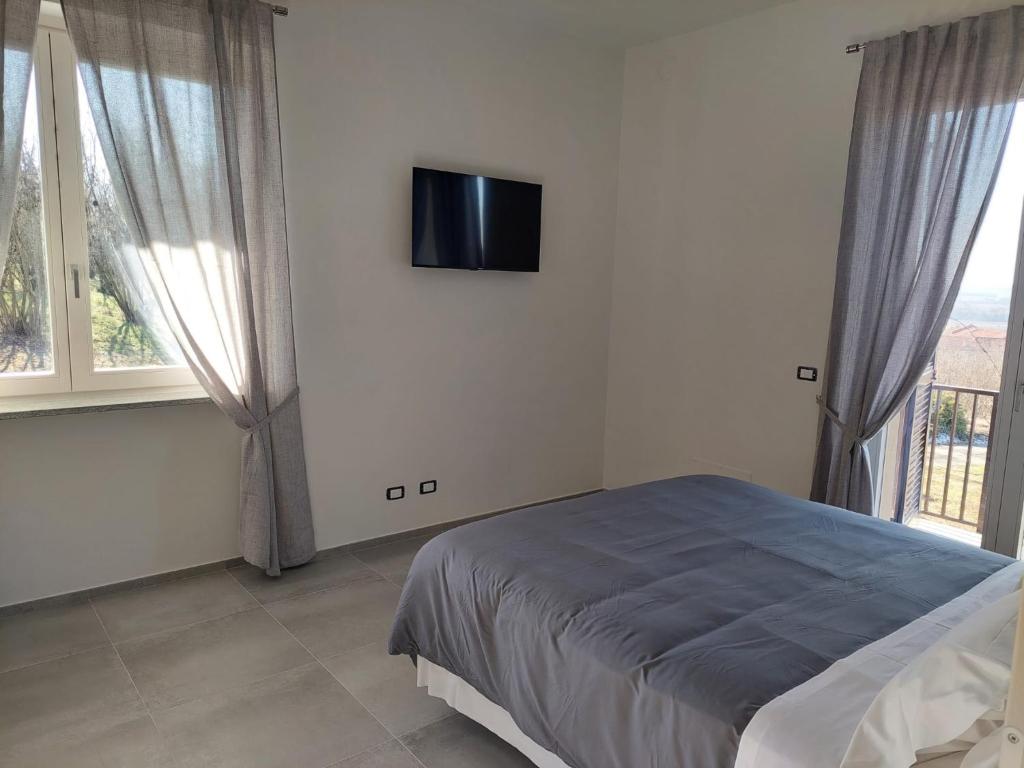 Postel nebo postele na pokoji v ubytování La Casa in Rivalta
