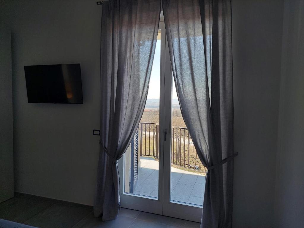 TV a/nebo společenská místnost v ubytování La Casa in Rivalta
