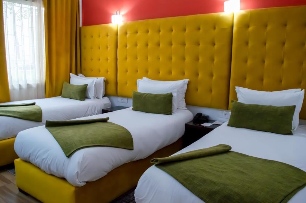 Postel nebo postele na pokoji v ubytování Hotel Le Musée
