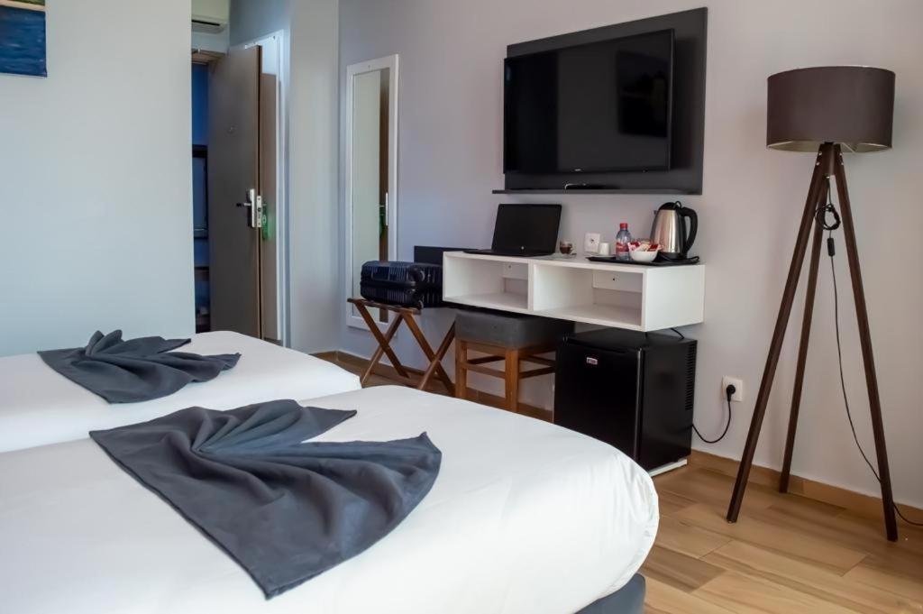 Postel nebo postele na pokoji v ubytování Hotel Le Musée