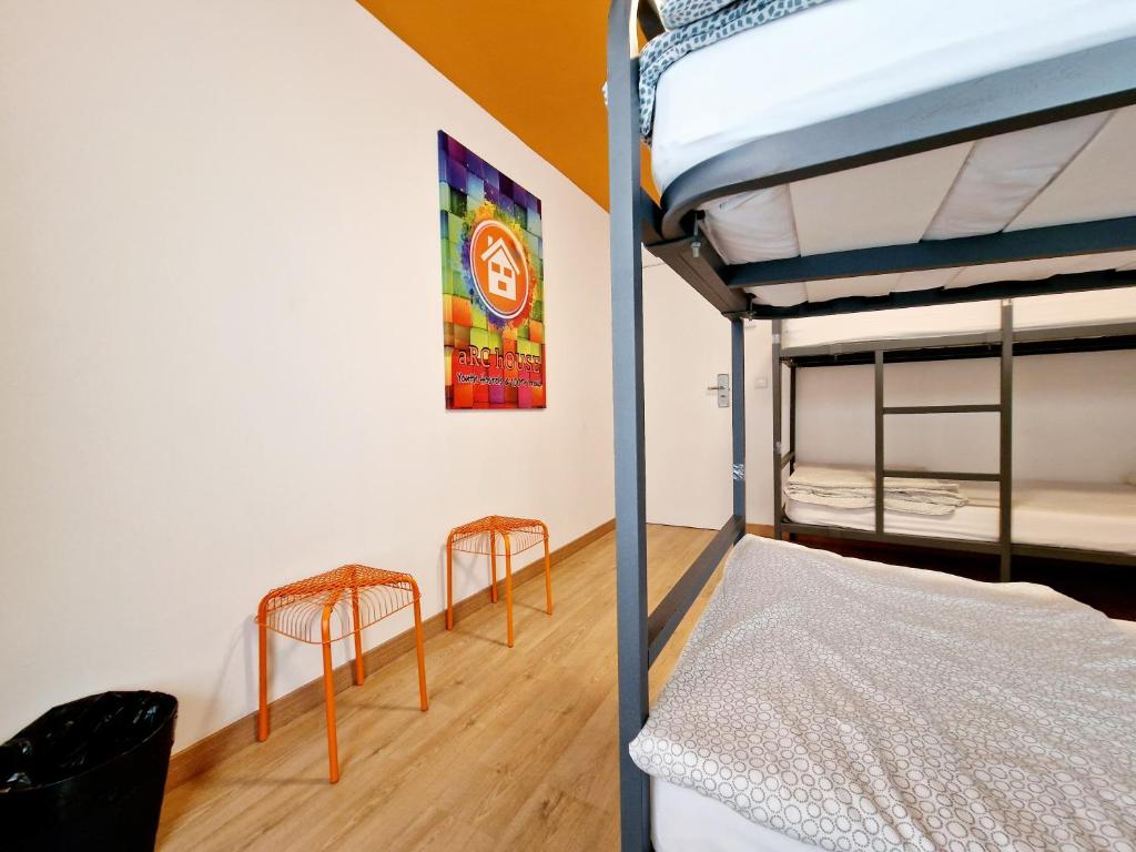 Postel nebo postele na pokoji v ubytování Arc House Barcelona