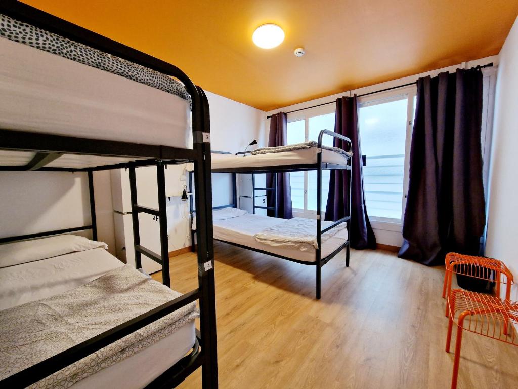 Postel nebo postele na pokoji v ubytování Arc House Barcelona