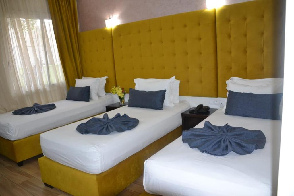 Postel nebo postele na pokoji v ubytování Hotel Le Musée