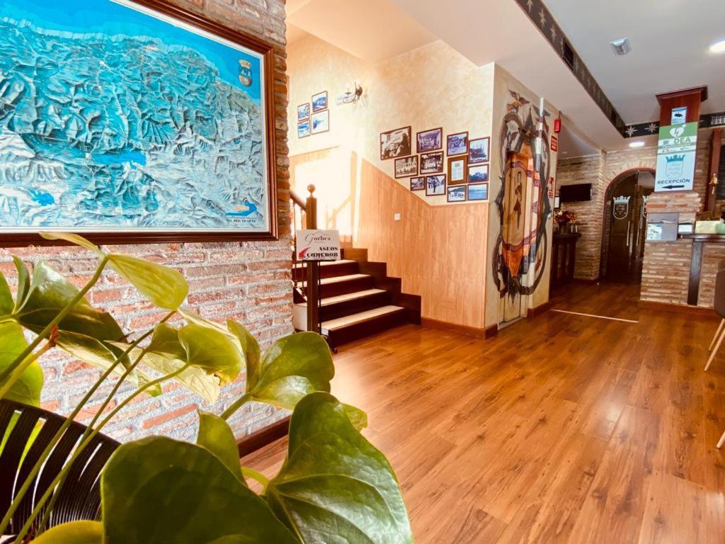 a living room with a large painting on the wall at El Tejo de Comillas in Comillas