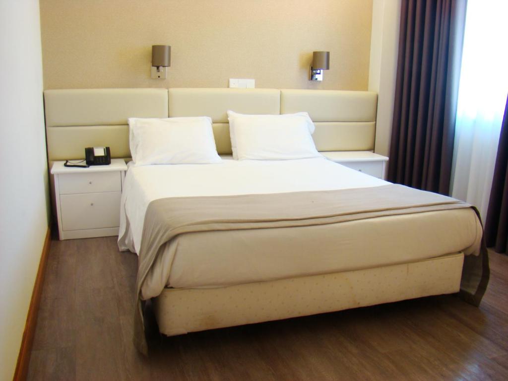 Postel nebo postele na pokoji v ubytování Seculo Hotel