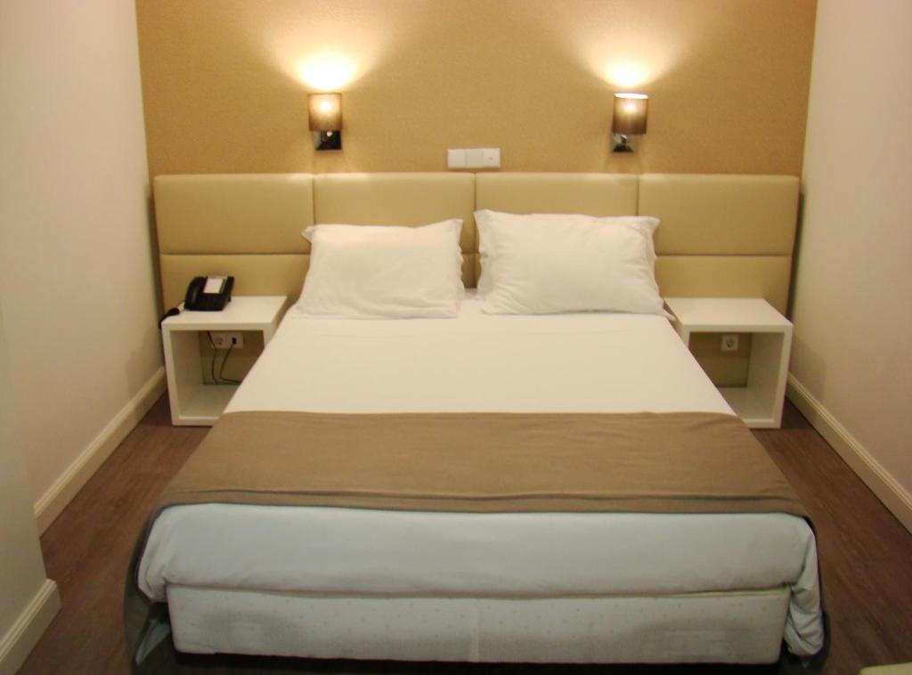 Postel nebo postele na pokoji v ubytování Seculo Hotel