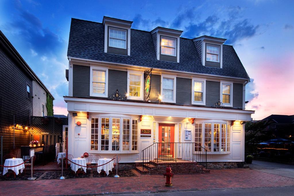 a house with a fire hydrant in front of it at Bouchard Restaurant & Inn in Newport