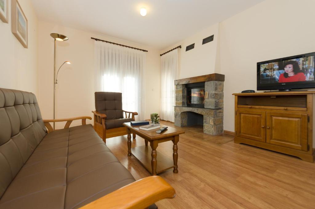 TV a/nebo společenská místnost v ubytování Hotel Apolo