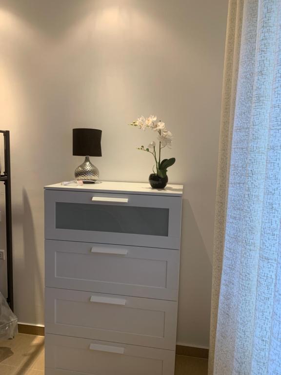TV a/nebo společenská místnost v ubytování Appartement de standing Résidence Kariat Cabo